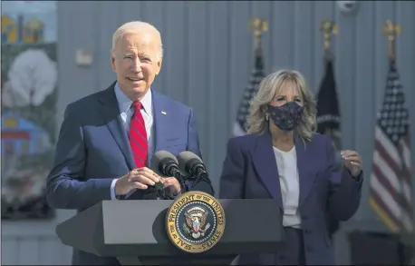  ?? MANUEL BALCE CENETA — THE ASSOCIATED PRESS ?? President Joe Biden, with first lady Jill Biden, speaks during a visit at Brookland Middle School in northeast Washington Sept. 10. Biden has encouraged every school district to promote vaccines, including with on-site clinics, to protect students as they return to school amid a resurgence of the coronaviru­s.