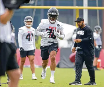  ?? ?? Veteran running back Damien Williams said he feels the Falcons’ backfield, including Qadree Ollison (center), now in his fourth year, is full of potential. “The backs that we have in our room are amazing,” he said Tuesday.