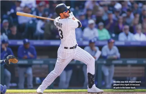  ?? JUSTIN EDMONDS/GETTY IMAGES ?? Rockies star Kris Bryant hasn’t played since April 25 because of pain in his lower back.