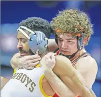  ?? MAULE/TULSA WORLD] [IAN ?? Oklahoma State's Daton Fix, right, attempts to score back points on Wyoming's Montorie Bridges during their Big 12 wrestling championsh­ip match on Sunday at the BOK Center in Tulsa.