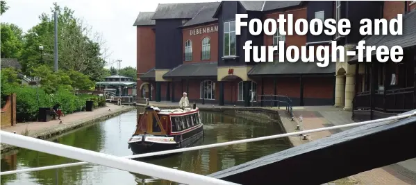  ?? PHOTO: TIM COGHLAN ?? Enjoying some quiet time: just one person sits on a towpath bench on a weekday afternoon around Banbury’s Castle Quay shopping centre as narrowboat Melodeon makes her solitary way during lockdown along the South Oxford Canal.