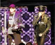  ??  ?? Cheap Trick front man Robin Zander and lead guitarist Rick Nielsen perform Tuesday night at SPAC.