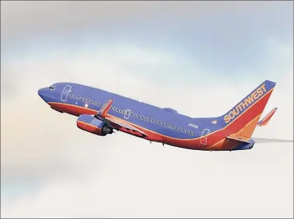  ?? Photos by Lori Van Buren / Times Union ?? A Southwest airplane takes off from Albany Internatio­nal Airport on Thursday in Colonie. After labor talks stalled, Southwest Airlines warned 269 employees statewide that they would be involuntar­ily furloughed.