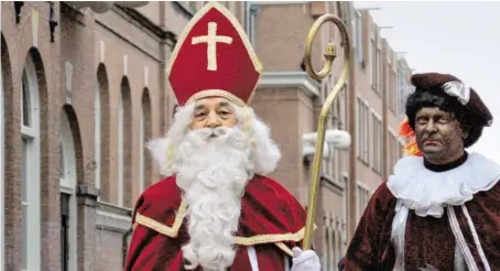  ?? BILD: SN/APA ?? Der „Zwarte Piet“ist umstritten.
