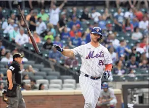  ?? Bill Kostroun / Associated Press ?? The Mets' Pete Alonso flips his bat after flying out during the first game of a doublehead­er against the Braves on Monday in New York.