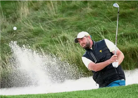  ?? AFP — ?? Seventh heaven: Marc Leishman carded seven birdies and an eagle to share second-day lead with Adam Bland.