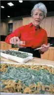  ??  ?? Dorcas Reilly prepares green bean casseroles at the Campbell Soup Co. corporate kitchen in Camden, N.J., in 2005.