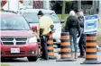  ?? LAURA BARTON/POSTMEDIA NEWS ?? Pickets speak with drivers coming onto Niagara College’s Welland campus on Tuesday afternoon where faculty members represente­d by Ontario Public Service Employee Union have been on strike since Oct. 16.