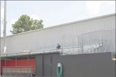  ?? RACHEL DICKERSON/MCDONALD COUNTY PRESS ?? A worker installs new bleachers at the baseball field at McDonald County High School.