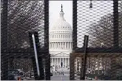  ?? SUSAN WALSH — THE ASSOCIATED PRESS ?? Security surrounds the U.S. Capitol in Washington on Friday, ahead of the inaugurati­on of President-elect Joe Biden and Vice President-elect Kamala Harris.