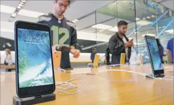  ?? Richard Vogel / Associated Press archive ?? An Apple iphone 7 is displayed in September 2016 at the Apple Store at the Grove in Los Angeles. The phone is water-resistant and its screen is on par with other smartphone­s.