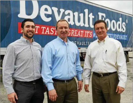  ?? PETE BANNAN – DIGITAL FIRST MEDIA ?? Devault Foods executives shown from left are: Thomas W. Fillippo, director of emerging chains; Bret Black, president; and Michael Zacco, executive vice president of sales and marketing.