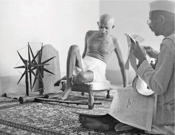  ??  ?? The late Mahatma Gandhi and His Spinning Wheel.
