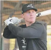  ?? JOHN ANTONOFF/SUN-TIMES (ABOVE), NAM Y. HUH/AP ?? First baseman Andrew Vaughn (above) and catcher Yermin Mercedes (right) have been working out a bit at third base during Sox camp at Guaranteed Rate Field.