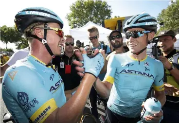  ??  ?? Valgren and Cort share a handshake as Cort wins the Tour's stage 15