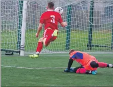  ??  ?? Scott Maitland hurdles Sandy Thomson before putting the ball in the net to open the scoring for Saints.