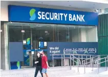  ?? BW FILE PHOTO ?? SECURITY BANK Corp. saw its net income drop by 26.7% to P7.4 billion in 2020 as it set aside more loan loss reserves amid the crisis.