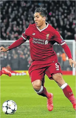  ?? Picture: AFP PHOTO /PAUL ELLIS ?? NIMBLE FEET: Liverpool’s Brazilian midfielder Roberto Firmino controls the ball during the Uefa Champions League match against FC Porto at Anfield in Liverpool