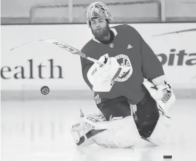  ?? PABLO MARTINEZ MONSIVAIS / THE ASSOCIATED PRESS ?? Washington Capitals goaltender Braden Holtby — at practice in Arlington on Friday — went from beginning the playoffs as the backup to having his name now mentioned in the Conn Smythe Trophy conversati­on.