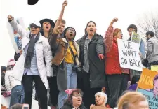  ?? ROBERT HANASHIRO, USA TODAY ?? Protesters chat anti- Trump slogans during Saturday’s peaceful Women’s March on Washington.