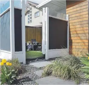  ?? Kathryn Scott, Special to The Denver Post ?? A blanket of artificial turf softens a formal garden room in the Perez’s yard in the Krisana Park neighborho­od of Denver.