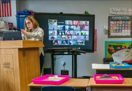  ?? Andrew Rush/Post-Gazette ?? Aubrey Cathcart, a third-grade teacher with Manchester Academic Charter School, teaches remote students from her classroom in Manchester.