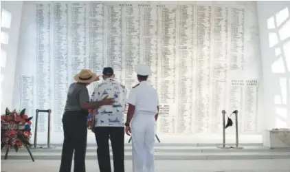  ?? Mark Comon, USS Arizona Memorial Foundation ?? Lauren Bruner, center, one of five remaining survivors of the USS Arizona, is joined in June 2013 by Capt. Jeffrey W. James, right, then-commander of Joint Base Pearl Harbor-Hickam, and Daniel Martinez, chief historian for the National Park Service....