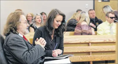  ?? TARA BRADBURY/THE TELEGRAM ?? Defence lawyers Bob Buckingham and Brittany Whalen (foreground) wait for their client Steve Bragg’s case to be called in provincial court in St. John’s Thursday morning. Behind them sit family members and friends of Victoria Head, the 36-year-old woman...