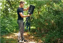  ?? AP file ?? Microsoft researcher Ethan Jackson sets up a trap for mosquitoes in Harris County, Texas. —