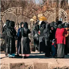  ?? AFP ?? Many women, dressed in hijabs, were seen standing in groups on roads leading to the university campuses yesterday.