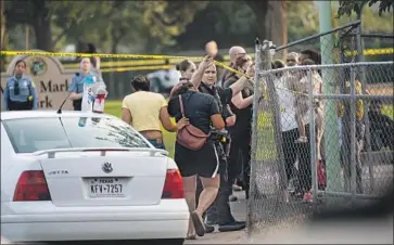  ?? Xavier Mascareñas Sacramento Bee ?? SACRAMENTO police interview people Saturday at Margarette “Mama” Marks Park, where Makaylah Brent, 9, was killed in drive- by shooting during a birthday party. Her cousin, 6, and aunt were wounded.