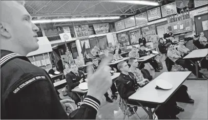  ?? [ERIC ALBRECHT/DISPATCH] ?? Bradley Rumann, a nuclear-trained machinist’s mate 1st class on the USS Columbus, describes life on a submarine to members of the Navy Junior Reserve Officer Training Corps program at Grove City High School.