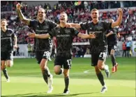  ?? (AFP) ?? Union Berlin players celebrates the team’s 4th goal during the German first division Bundesliga match in Freiburg, on Saturday.