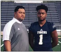  ?? Photo courtesy of Junior Soli ?? Highly recruited defensive end Mataio Soli is pictured with his father, former Arkansas Razorbacks defensive lineman Junior Soli. Mataio committed to the University of Arkansas on June 9.