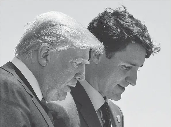  ?? SAUL LOEB / AFP / GETTY IMAGES FILES ?? U.S. President Donald Trump and Canadian Prime Minister Justin Trudeau share one of the few tranquil moments at the G7 Summit in La Malbaie, Que., in early June.