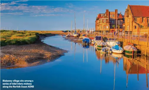  ??  ?? Blakeney village sits among a series of tidal inlets midway along the Norfolk Coast AONB