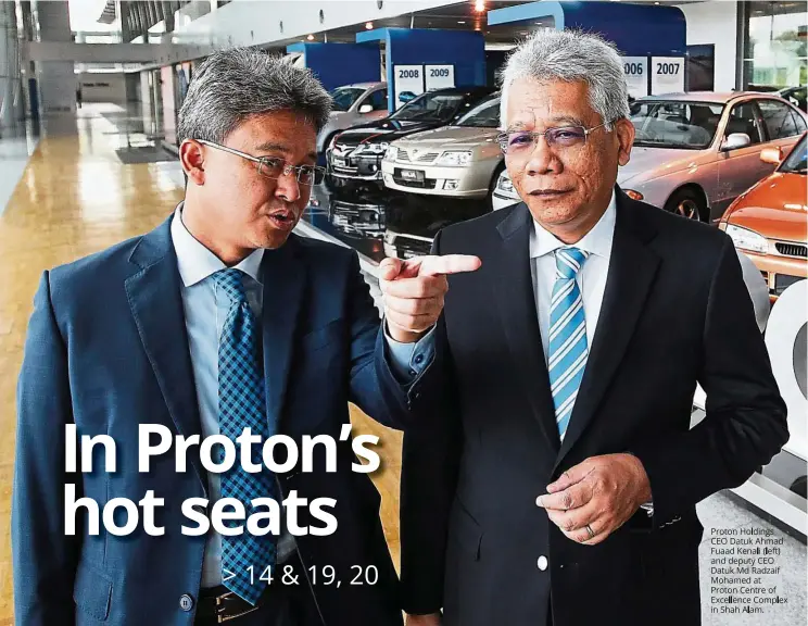  ??  ?? Proton Holdings CEO Datuk Ahmad Fuaad Kanali (left) and deputy CEO Datuk Md Radzaif Mohamed at Proton Centre of Excellence Complex in Shah Alam.