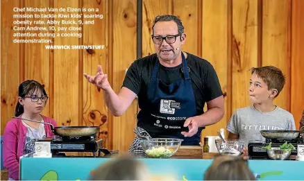  ?? WARWICK SMITH/STUFF ?? Chef Michael Van de Elzen is on a mission to tackle Kiwi kids’ soaring obesity rate. Abby Buick, 9, and Cam Andrew, 10, pay close attention during a cooking demonstrat­ion.