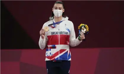  ?? Photograph: Themba Hadebe/AP ?? Bronze medallist Britain’s Bianca Walkden holds her medal and bouquet during the medal ceremony.