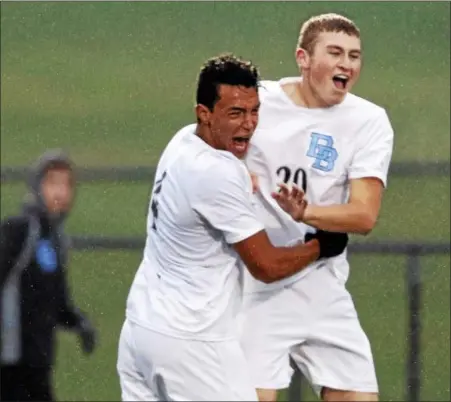  ?? KIRK NEIDERMYER - FOR DIGITAL FIRST MEDIA ?? Daniel Boone’s Ayoub Mouhou (4) celebrates with Carter Ferguson (20) after scoring a goal in the first half at Cedar Crest High School in South Lebanon on Thursday, October 27.