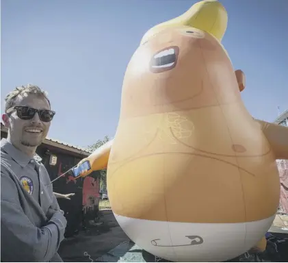 ??  ?? 0 The nappy-clad, phone-wielding orange baby balloon version of Trump will float above the Commons on Friday