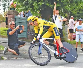  ?? THE ASSOCIATED PRESS ?? Team Sky cyclist Geraint Thomas competes Saturday in the 20th stage of the Tour de France, an individual time trial that covered 19.3 miles from Saint-Pee-sur-Nivelle to Espelette. He has an overall lead of nearly two minutes heading into today’s final...