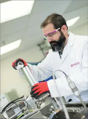  ?? PHOTOS PROVIDED TO CHINA DAILY ?? An Evonik technician does an experiment at the company’s lab in Birmingham.