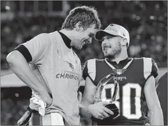  ?? DAVID J. PHILLIP/AP PHOTO ?? Patriots quarterbac­k Tom Brady, left, speaks to wide receiver Danny Amendola (80) after winning the AFC championsh­ip on Sunday, beating the Jaguars 24-20 at Foxborough, Mass.