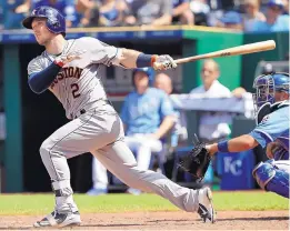  ?? ORLIN WAGNER/ASSOCIATED PRESS ?? Albuquerqu­e native Alex Bregman homers as Houston won its 10th straight game Saturday. It was the 27th consecutiv­e game Bregman has been on base.
