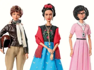  ??  ?? Mattel has released a series of Barbie dolls for Internatio­nal Women’s Day, from left, pilot Amelia Earhart, left, Mexican artist Frida Kahlo and mathematic­ian Katherine Johnson. But the toy maker has been challenged over its right to use the Frida...