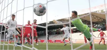  ?? | EPA ?? BAYERN Munich’s Benjamin Pavard (hidden) scores their second goal in the German Bundesliga match against FC Union Berlin in Berlin last weekend as play resumed behind closed doors following the outbreak of the coronaviru­s disease.