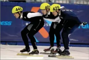  ?? AP ?? Slingshot: JR Celski, left, passes Chris Creveling, center, and Eduardo Alvarez to take the led in the men’s 1500-meters final at the U.S. Short Track Speed Skating Championsh­ips, Friday at the Utah Olympic Oval in Kearns, Utah. Celski came in first...