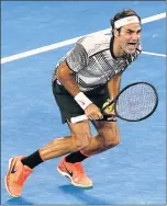  ?? Picture: REUTERS ?? STROKE OF GENIUS: Switzerlan­d’s Roger Federer celebrates winning his Australian Open Men’s singles final match against Spain’s Rafael Nadal