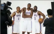  ?? SUE OGROCKI — THE ASSOCIATED PRESS FILE ?? In this file photo, Oklahoma City Thunder’s Russell Westbrook (0), Kevin Durant, center, and James Harden (13) pose for a photo for NBA basketball photograph­ers during media day in Oklahoma City. The Thunder are heading into a major transition. Westbrook was the last remaining player from the team that moved from Seattle to Oklahoma City in 2008. Durant, Harden, Serge Ibaka, Paul George and others are all gone. Now Westbrook will soon be on his way to Houston after an 11-year career with the franchise.